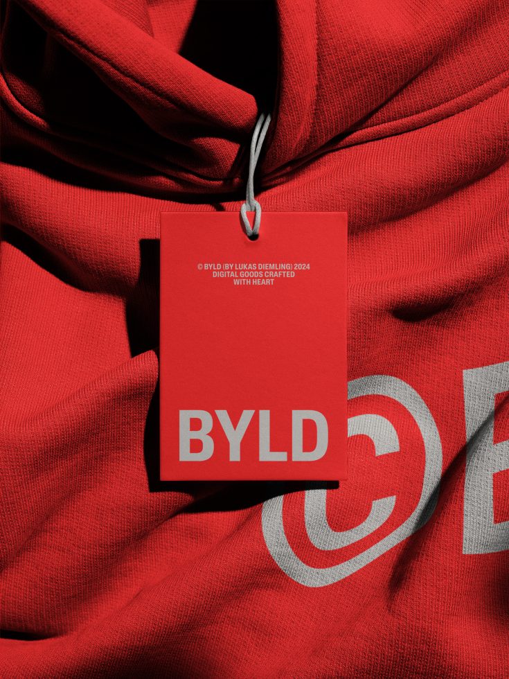 Red hoodie mockup with brand tag design for fashion designers, showcasing detailed textile texture and label branding.