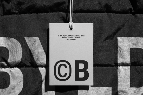 High-contrast black and white mockup tag featuring bold CB logo design, textured background, ideal for showcasing brand identity.