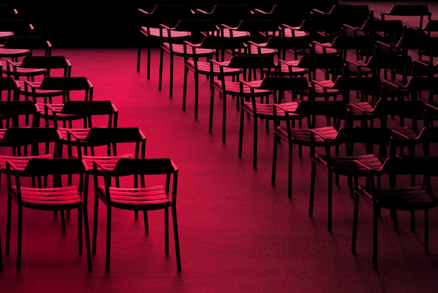 Red-tinted empty chairs in a dark room, evoking a moody atmosphere, ideal for graphics, templates, and background design elements.