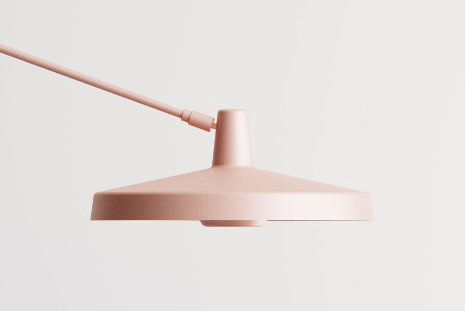 Minimalist pendant lamp with blush pink cord on neutral background