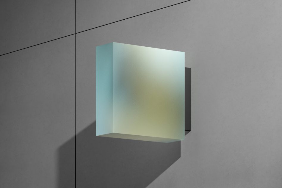 Frosted glass cube with teal to yellow gradient on minimal concrete wall
