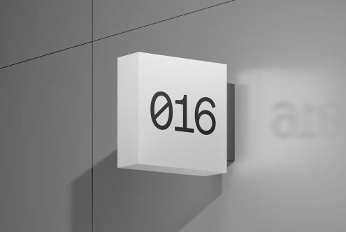 3D wall-mounted box mockup with the number 016 prominently displayed. Perfect for signage design, branding, and architectural visualization.