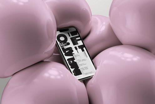 3D smartphone mockup with abstract glossy pink balloon shapes displaying a black and white typographic design, ideal for presenting UI/UX designs.