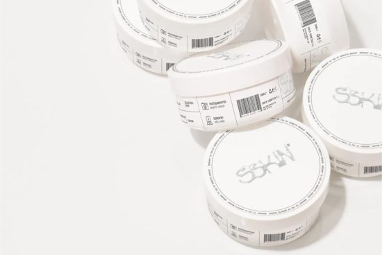 Minimalistic skincare packaging design mockup featuring multiple cream jars with labels on a clean white background, ideal for beauty product branding.