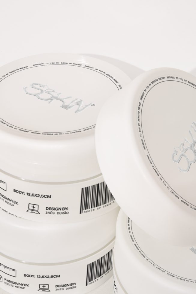 Stacked white skincare jar mockups with editable labels, perfect for designers to display cosmetic brand designs.