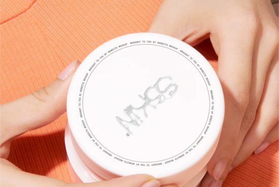 Close-up view of a cosmetics jar held in hands for mockup, showcasing design space on lid, perfect for beauty packaging designers.