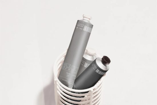 Cosmetic tubes mockup in white basket with neutral background, ideal for presenting packaging designs to clients in the beauty industry.