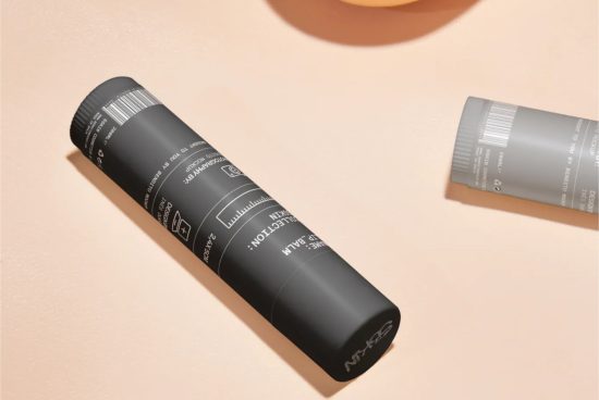 Cosmetic tube packaging mockup on a pale background with shadow, showcasing label design space for beauty products.