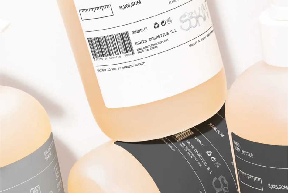 Close up of peach bottle label showing barcode, product details, dark bottle nearby