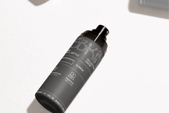 Black spray bottle mockup with detailed labeling, realistic shadows on a white background, perfect for packaging design presentations.