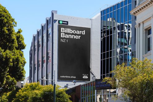 Urban billboard mockup on building facade for advertising design presentation, clear blue sky, realistic city environment, outdoor advertising space.