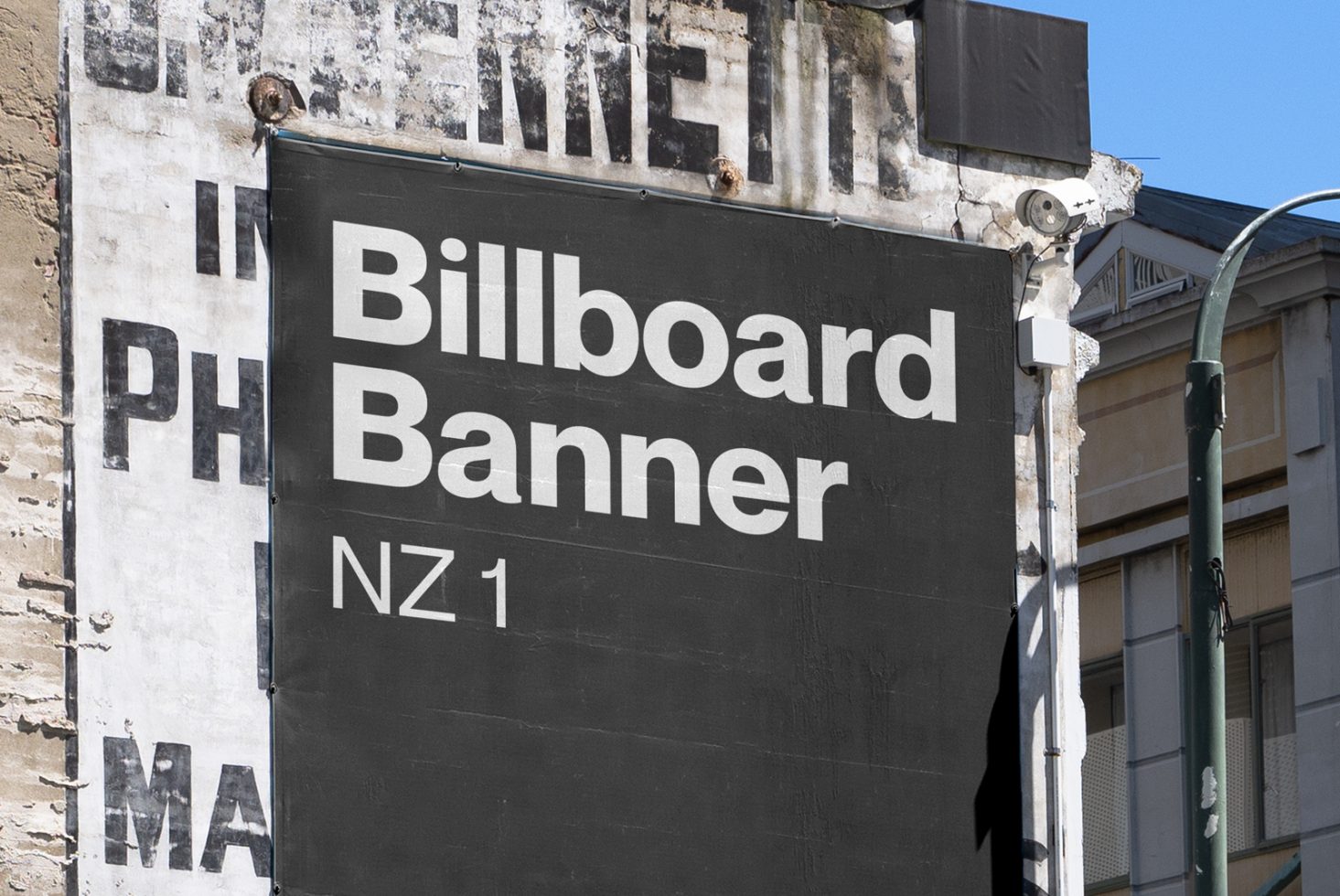 Urban billboard banner mockup against a textured wall for outdoor advertising design presentation.