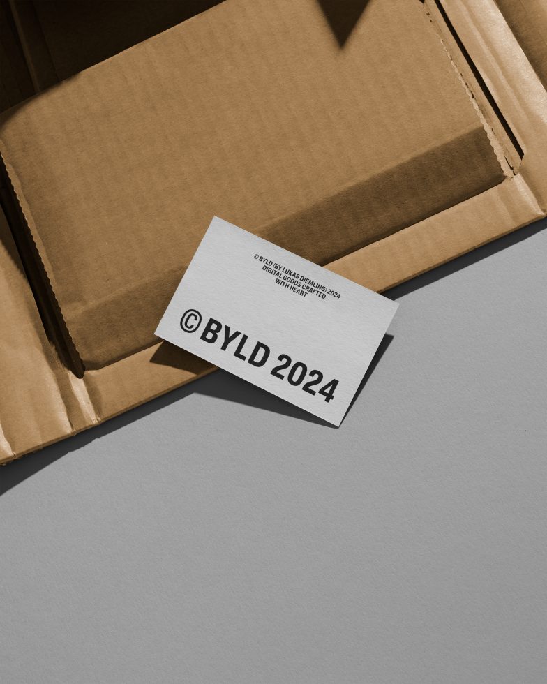 Business card mockup with shadow on textured background next to cardboard, showcasing modern design and branding for designers.