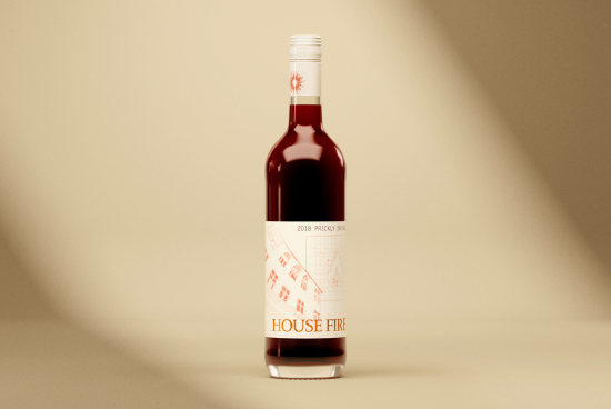 Wine bottle with elegant label design mockup on a beige background, suitable for graphics and product presentation.