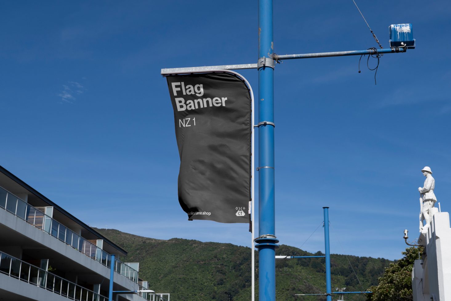 Vertical flag banner mockup on blue pole with clear sky, outdoor advertising, graphic design display, marketing mockup template.