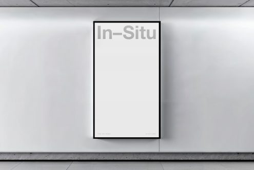 Blank vertical billboard mockup mounted on a concrete wall inside a building, ideal for designers to showcase advertising designs.