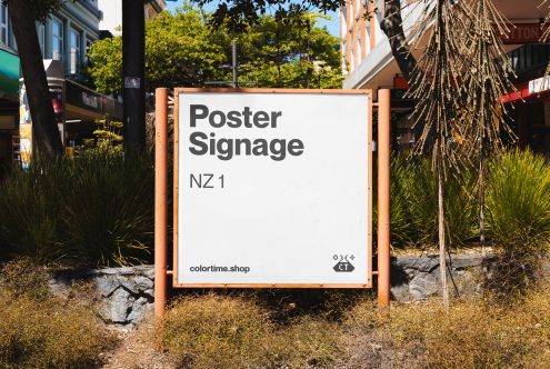 Urban street poster mockup on a signboard with natural background for advertising and branding design presentations.