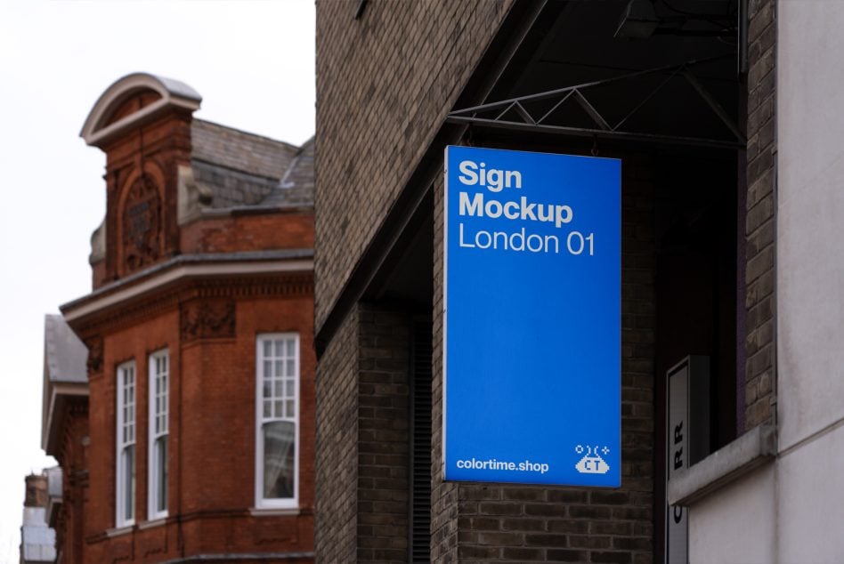Blue rectangular wall-mounted sign on brick, modern sans serif text