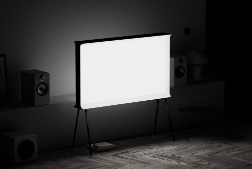 Blank billboard mockup in a dimly lit room with speakers, ideal for presenting designs and graphic assets for advertisements or presentations in a realistic setting.