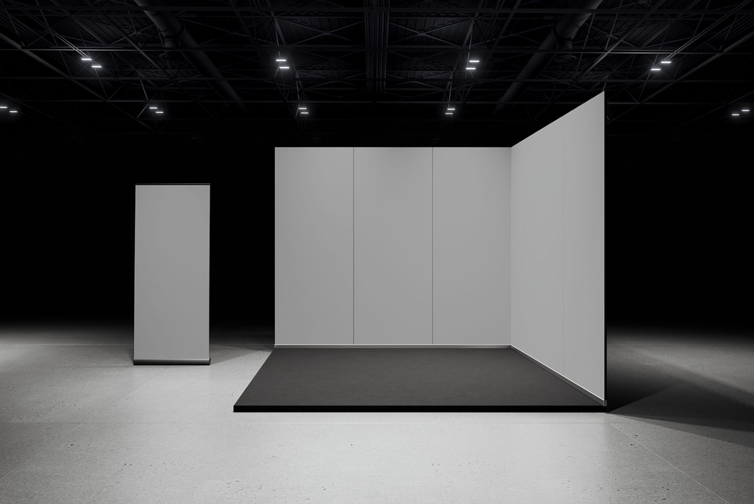 Minimalist exhibition stand mockup in a dark gallery space with spotlighting, suitable for showcasing design projects and graphics.