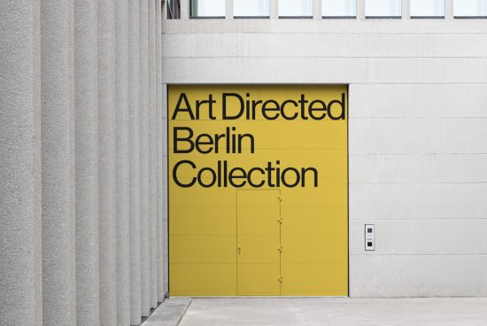 Urban poster mockup displaying bold typography for Art Directed Berlin Collection on a yellow background against a modern building facade.