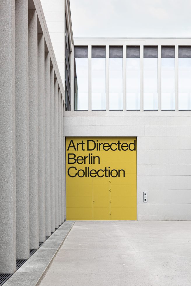 Modern poster mockup on a yellow surface with bold typography hanging on an urban building exterior, showcasing sleek design presentation.