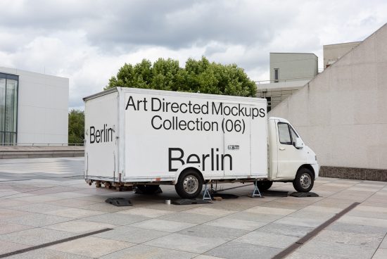 Delivery truck parked with text 'Art Directed Mockups Collection 06' on side, mockup template, urban environment, designer asset.