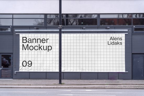 Urban exterior billboard mockup hung on building facade for outdoor advertising design presentations.