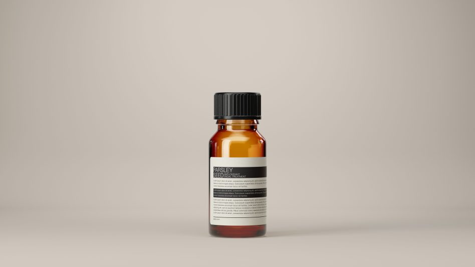 Product mockup of an amber glass bottle with a black cap and label design on a neutral background, ideal for branding presentations and packaging designs.