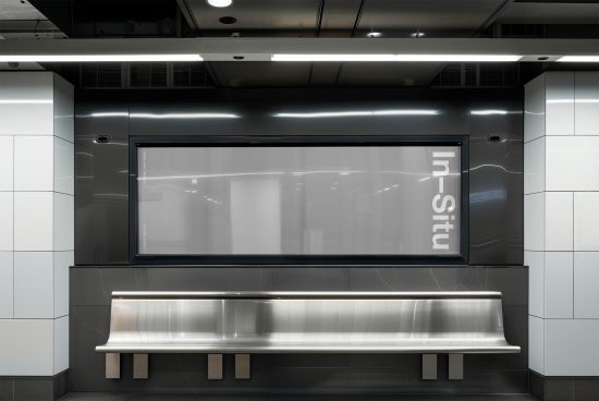 Modern subway station interior with blank billboard mockup for advertising design, bench, and sleek metal finishes.