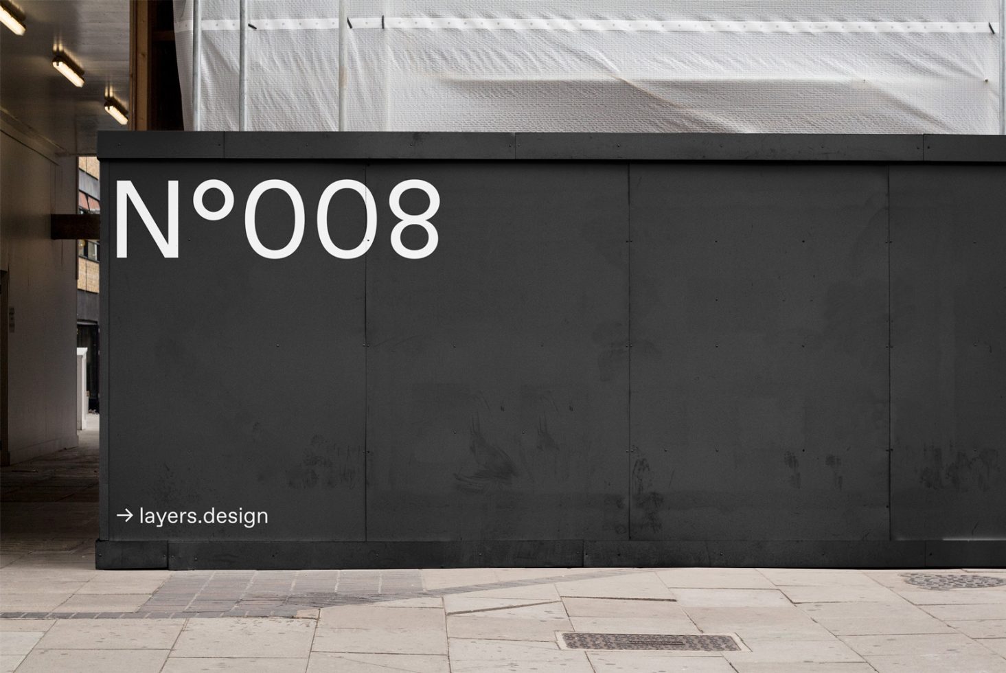 Urban wall mockup with black facade featuring white typographic design number 008 for showcasing fonts and graphics in a real-world setting.