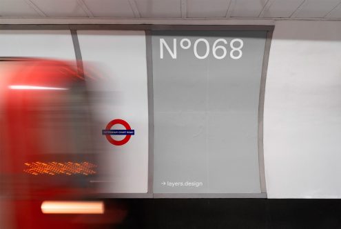 Blurred subway train passing by a station mockup ad space with clear signage for design template display.