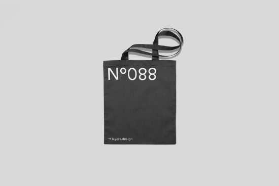Black tote bag mockup with white text N'088 on simple background, suitable for e-commerce product display and graphic design projects.