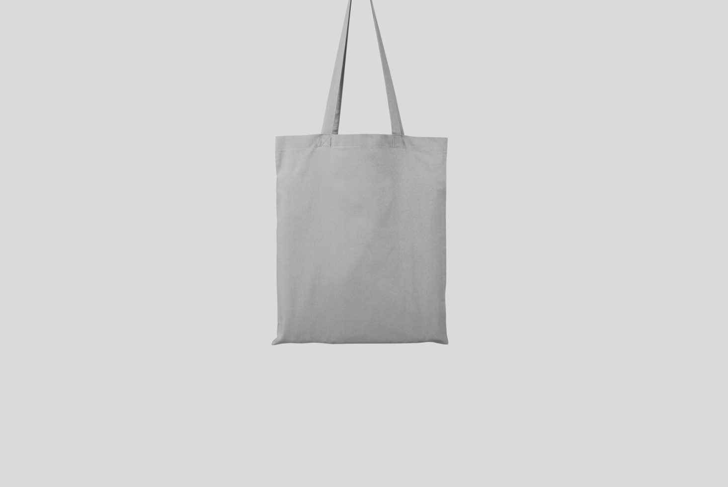 Blank canvas tote bag mockup on a white background, ideal for branding designs and logos, high-quality, versatile for graphic designers.