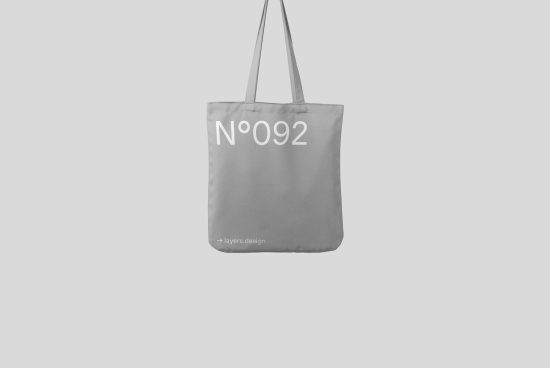 Minimalist tote bag mockup with number design on plain background perfect for showcasing typography or branding for designers.