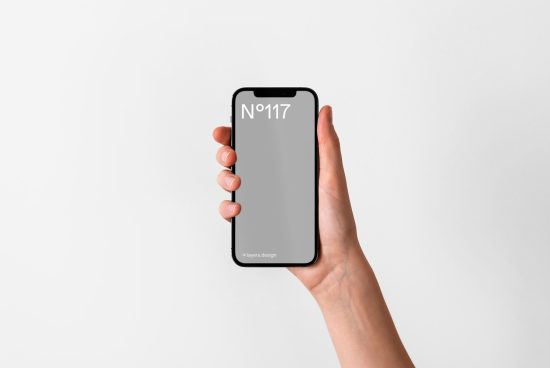 Hand holding a smartphone mockup against a white background for app design display, clean minimalistic style, digital asset for designers.