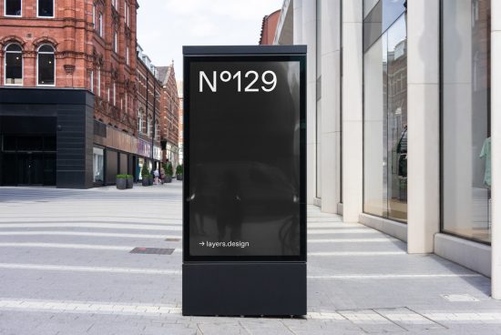 Urban digital kiosk mockup with editable screen on a city street, perfect for outdoor advertising designs, realistic urban setting.