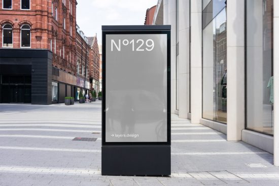 Urban digital billboard mockup in a street setting, showcasing advertising space for designers to insert graphics.