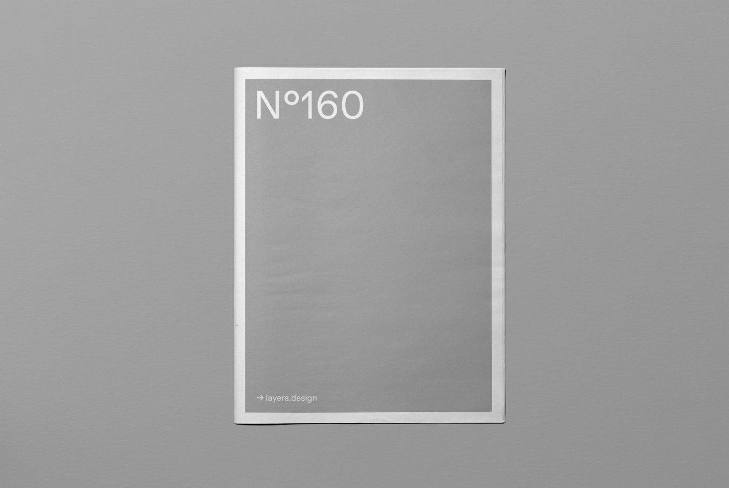 Minimal magazine cover mockup on grey background for print design presentation, simple layout, clean template, graphic design asset.