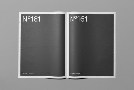 Open magazine mockup on grey background, ideal for presenting editorial designs, with realistic shadows and editable features.