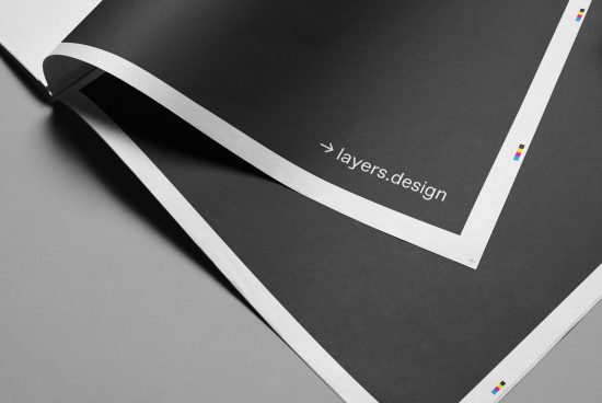 Elegant black magazine mockup with white branding text, designers can utilize for presentations or template showcases, with clean realistic shadows.