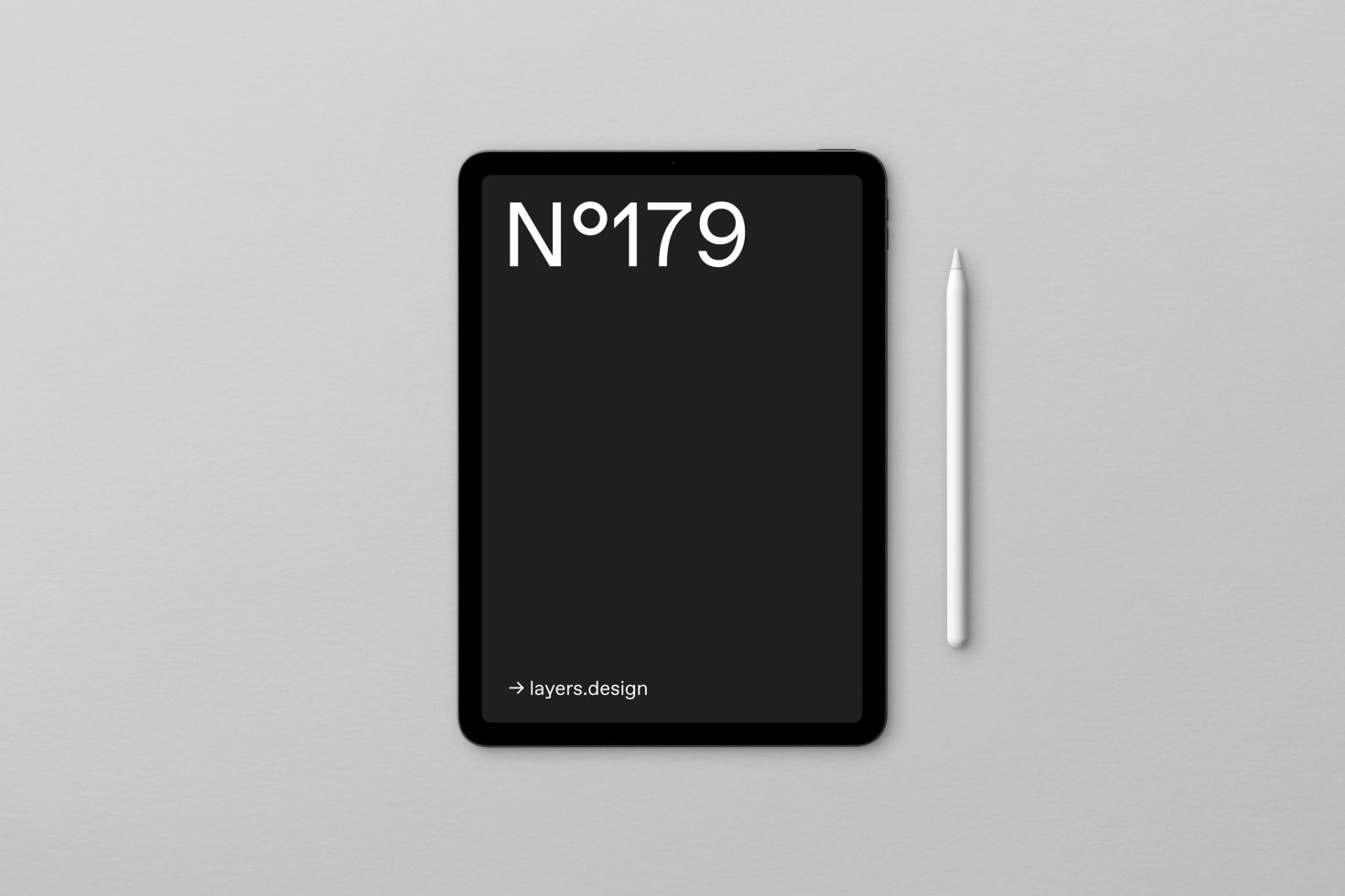 Digital tablet mockup with stylus on a grey background, minimalistic design for presenting apps, suitable for designers and web developers.