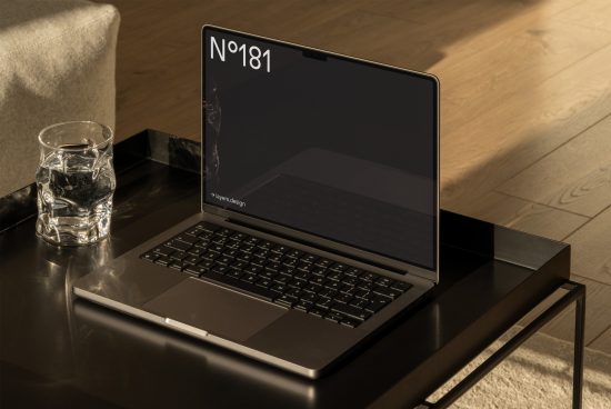 Elegant laptop mockup on coffee table for digital asset designers featuring screen space for design display, creating a professional presentation.