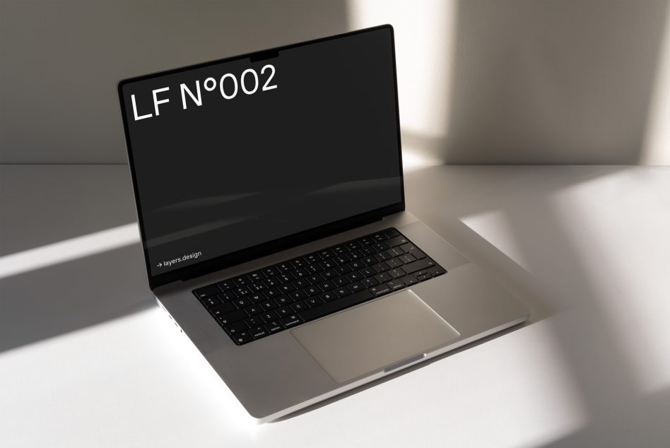 Laptop mockup angled view with dark screen on neutral background