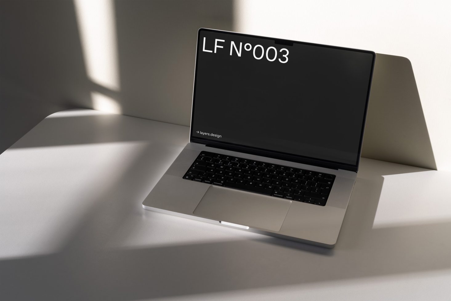 Laptop mockup with sleek design, sunlit minimalist setting, ideal for presentations, digital assets portfolio display, and designer workflows.