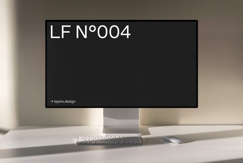 Minimalist computer monitor mockup with keyboard and mouse on a desk, showcasing sleek design for presentations and digital templates.