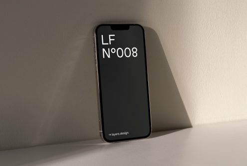 Smartphone on table showcasing sleek font design LF N°008, ideal for mockups, modern typography inspiration, digital design asset.