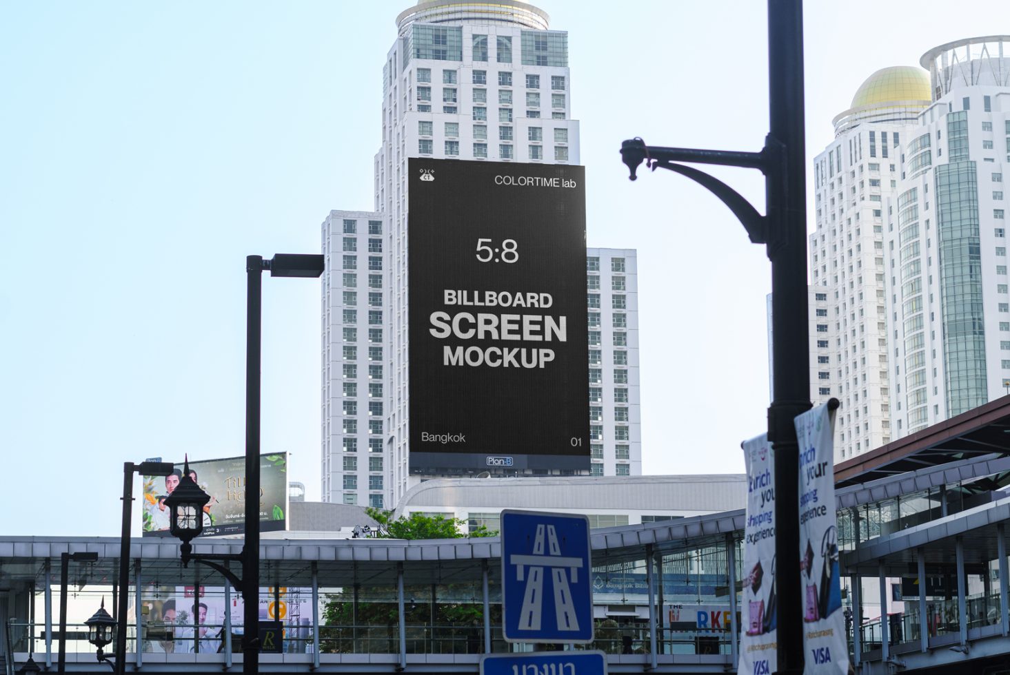 Urban billboard screen mockup on a building displaying advertising potential for designers in a cityscape setting, with clear sky background.