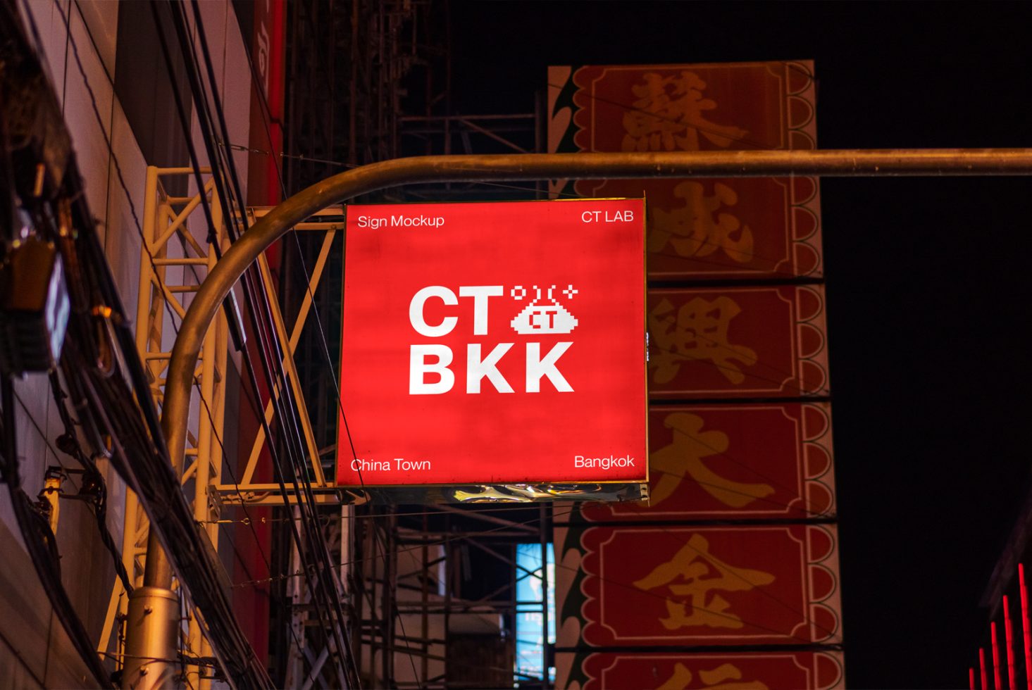 Urban street sign mockup at night for billboard design presentation, featuring red banner with pixel art style text reading CT LAB, CT BKK, China Town Bangkok.