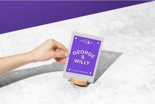 Hand holding a tablet with a purple screen mockup on a white and purple background, ideal for designers to display UI/UX designs.